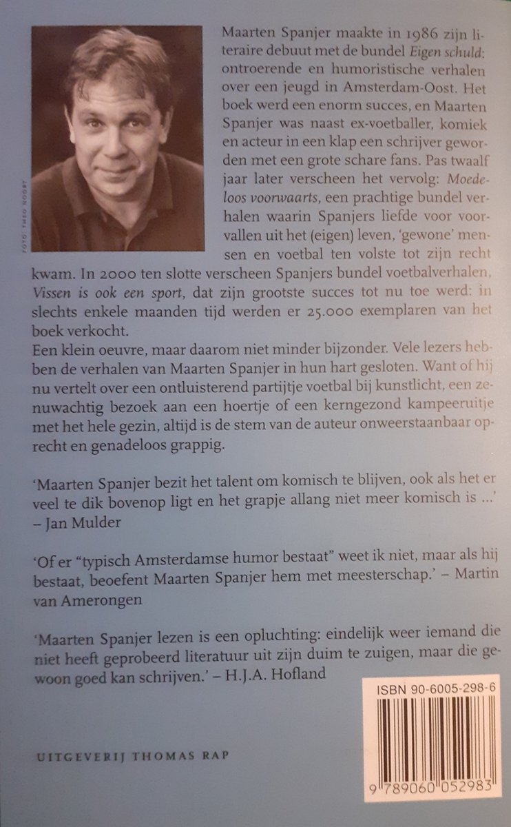 Portret van Maarten Spanjer met een grijze achtergrond. Hij draagt een donker overhemd.