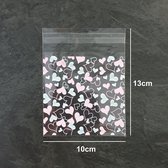 100x Uitdeelzakjes - Cellofaan Plastic Traktatie Kado Zakjes - Snoepzakjes - Hartjes - 10x10cm - Roze