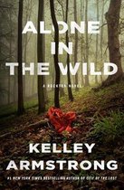 Boekomslag met de titel 'ALONE IN THE WILD' van KELLEY ARMSTRONG, in een bos met een rode doek op de grond.