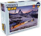 Puzzel Trein door het besneeuwde landschap in Zwitserland bij zonsopkomst - Legpuzzel - Puzzel 1000 stukjes volwassenen