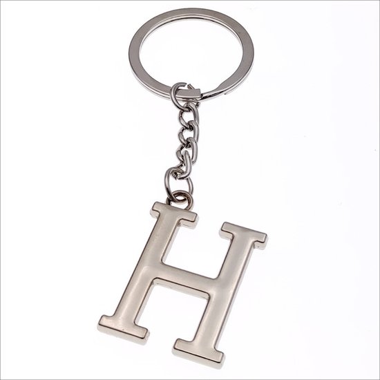 Porte-clés argenté avec la lettre H.