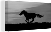 Canvas Schilderij Silhouet van een sprintende mustang paard - zwart wit - 40x20 cm - Wanddecoratie