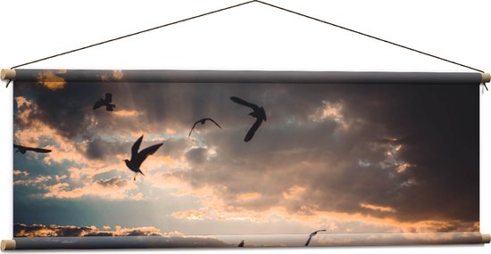 WallClassics - Textielposter - Vogels in de Lucht bij Zonsondergang - 120x40 cm Foto op Textiel