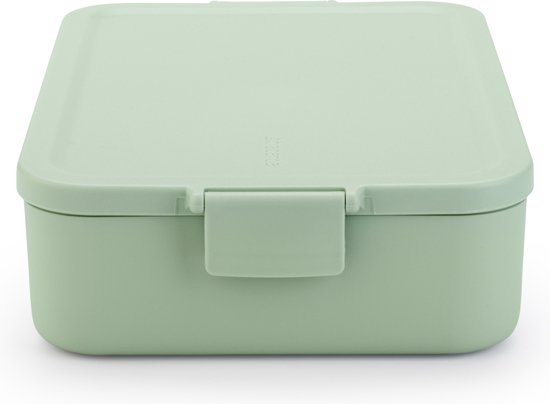 Boîte à pain Brabantia vert jade avec un fermoir à clip sur le devant.