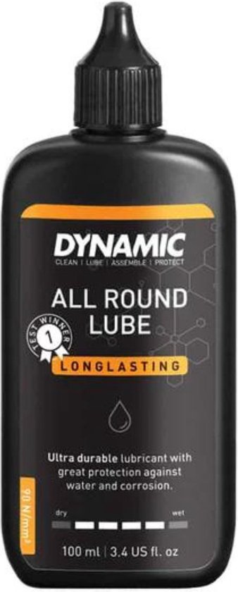 Zwarte fles Dynamic All Round Lube 100ml met oranje label waarop 'LONGLASTING' staat. Smeermiddel voor alle weersomstandigheden.