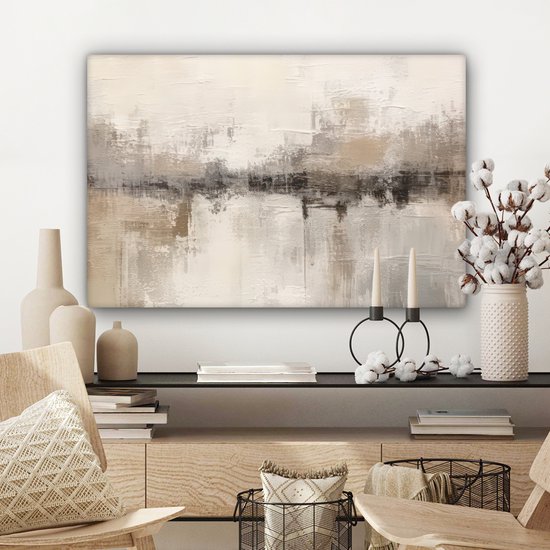 Tableau abstrait dans des tons beige, gris et brun avec texture visible, accroché au-dessus d'une commode avec des décorations.