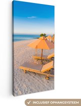 Canvas Schilderij Caribisch strand met strandstoel - 20x40 cm - Wanddecoratie