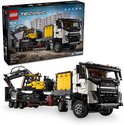LEGO Technic Volvo FMX truck met gele graafmachine op dieplader en verpakking.