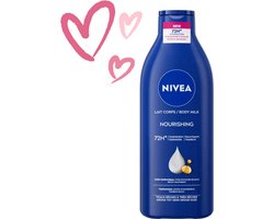 NIVEA Verzorgende Body Milk - met Hyaluronzuur Zachte Amandel Olie en Voedend serum - Body Melk met 72 Uur Hydratatie - Voor Droge tot Zeer Droge Huid - 400 ml