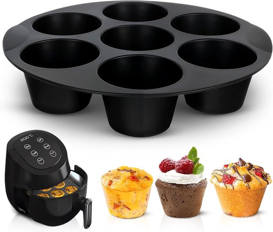 Zwarte siliconen bakvorm met 7 holtes, naast een airfryer en diverse afgewerkte muffins.