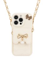 Crème telefoonhoesje, NUVEX, met goudkleurige strik, parel en schouderketting. Quilted design, met opbergvakje.