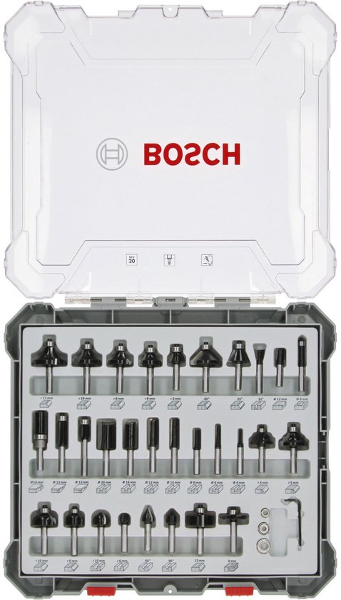 Bosch 30-delige frezenset geopend in kunststof cassette, met diverse profielen en maten.