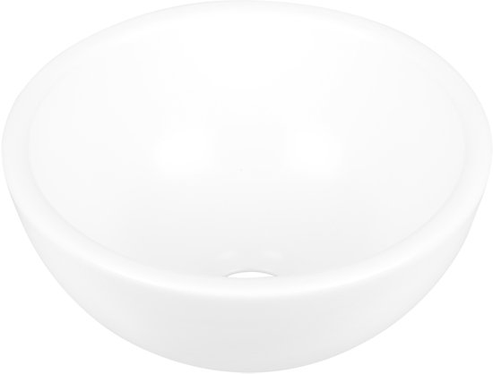 Ronde witte keramische waskom van 20 x 10 cm met een afvoerputje.