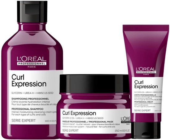 Trois produits L'Oréal Professionnel Curl Expression : shampooing, masque et crème.
