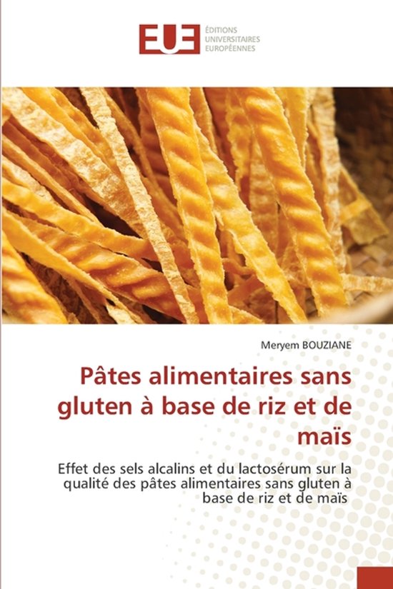 Livre: Pâtes alimentaires sans gluten à base de riz et de maïs. Gros plan sur des pâtes séchées et torsadées de couleur jaunâtre.