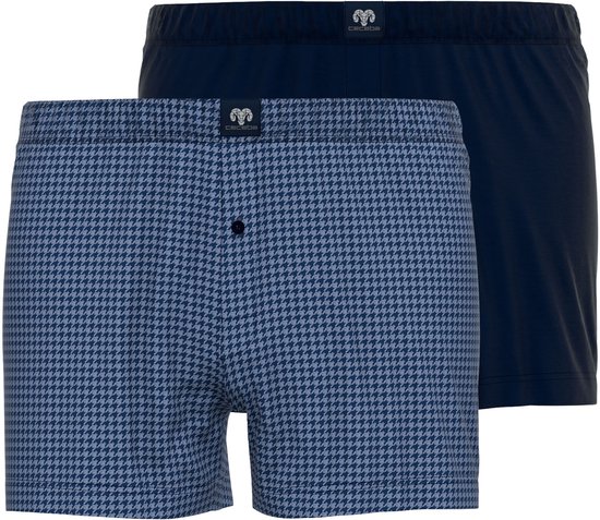 Twee Ceceba boxershorts: één met pied-de-poule patroon, één effen donkerblauw.