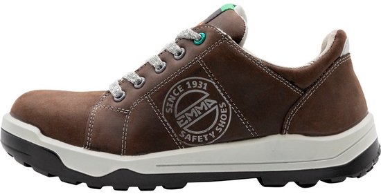 Zijaanzicht van een donkerbruine Emma veiligheidsschoen met witte zool en oranje/grijze veters. "SINCE 1931 EMMA SAFETY SHOES" logo.