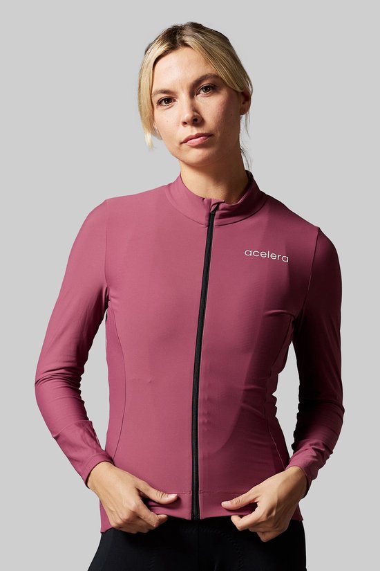 Dames Acelera fietsshirt met lange mouwen in roze, met zwarte rits en logo op de borst.