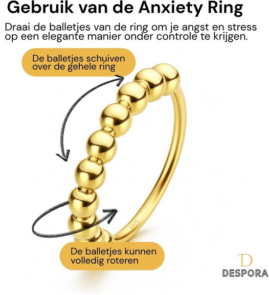 Gouden ring met balletjes die kunnen schuiven en roteren. "De balletjes schuiven over de gehele ring", "De balletjes kunnen volledig roteren".