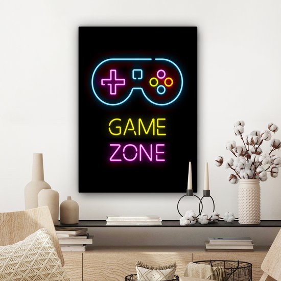 Toile noire avec néons : manette bleue, texte jaune 'GAME', texte rose 'ZONE', sur un mur décoré.