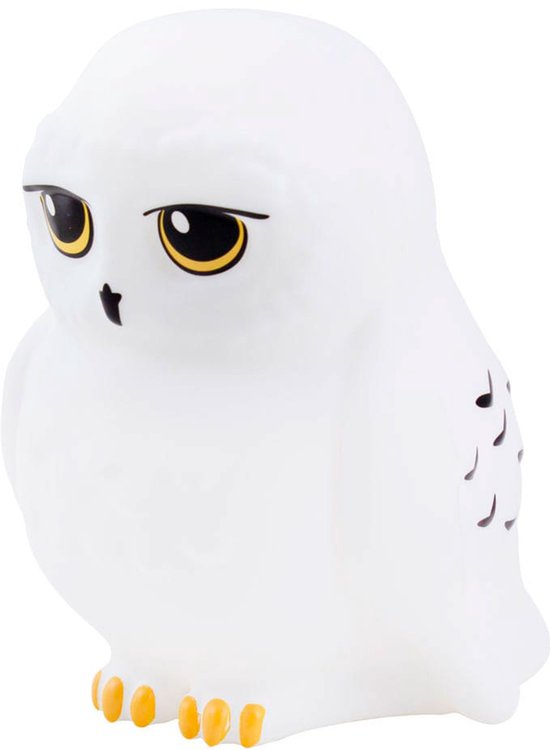 Lampe Hedwig blanche, aux yeux jaunes et pattes dorées.