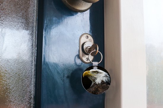 Porte-clés - Profil d'aigle sur fond noir - Plastique - Rond