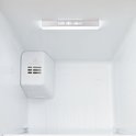 Binnenzijde van een koelkast met 'Eco LED Light' en 'Cooling' ventilatiesysteem.