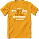 87 Jaar Legend T-Shirt | Goud - Wit | Grappig Verjaardag en Feest Cadeau Shirt | Dames - Heren - Unisex | Tshirt Kleding Kado | - Geel - S