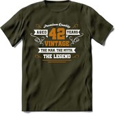 42 Jaar Legend T-Shirt | Goud - Wit | Grappig Verjaardag en Feest Cadeau Shirt | Dames - Heren - Unisex | Tshirt Kleding Kado | - Leger Groen - L