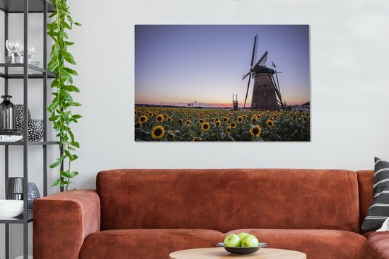 Tableau sur toile Vieux moulin à vent se dresse dans un champ avec des tournesols - 120x80 cm - Décoration murale