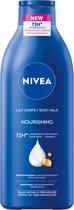 NIVEA Verzorgende Body Milk - met Hyaluronzuur Zachte Amandel Olie en Voedend serum - Body Melk met 72 Uur Hydratatie - Voor Droge tot Zeer Droge Huid - 400 ml