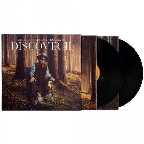Dubbel vinyl albumhoes met Zucchero zittend in een bos met een hond.