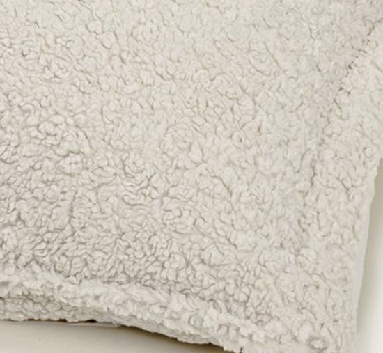 Detail van crèmekleurige teddy stof.