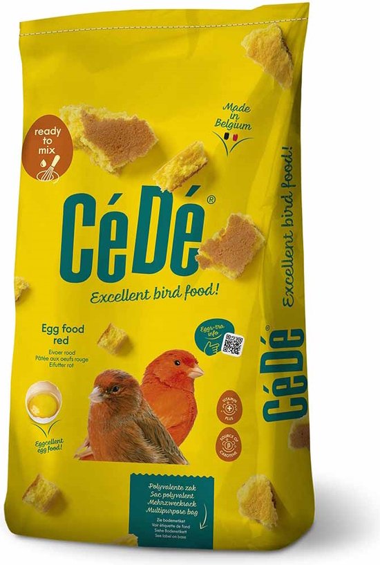 Gele verpakking met 'CéDé Excellent bird food!' opdruk, stukjes cake en twee rode vogels.