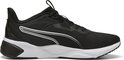 Zwarte PUMA sportschoen met witte accenten, witte zool en zwarte veters.