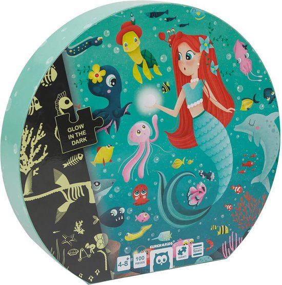 Doos van een ronde puzzel met een zeemeermin, haai, dolfijn, schildpad en veel zeedieren. 'Glow in the dark' staat op de doos.