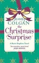 Boek 'The Christmas Surprise' van Jenny Colgan. Groene kaft met gouden sneeuwvlokken, een strik en de titel in paarse letters.