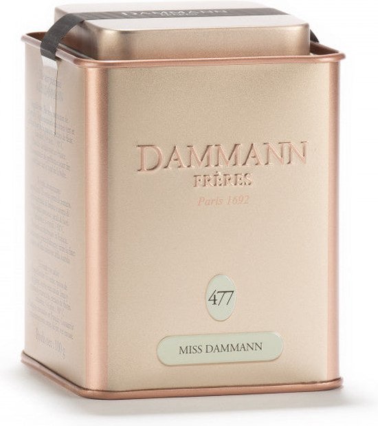 Goudkleurige blik met het Dammann Frères logo, '477' en 'MISS DAMMANN'.