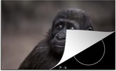 KitchenYeah® Inductie beschermer 81.6x52.7 cm - Close-up van een gorilla - Kookplaataccessoires - Afdekplaat voor kookplaat - Inductiebeschermer - Inductiemat - Inductieplaat mat