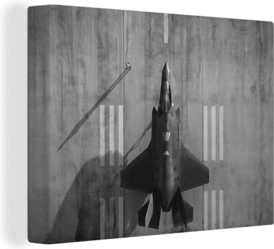 Canvas Schilderij De straaljager F-35 Lightning II op de grond - zwart wit - 80x60 cm - Wanddecoratie