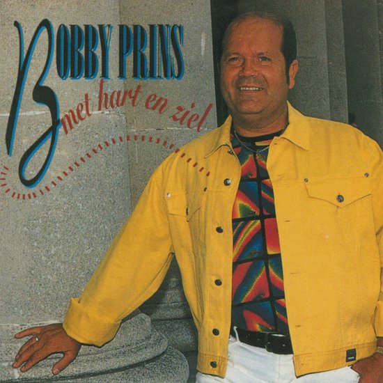 Bobby Prins met hart en ziel albumhoes. Een man in geel jack en kleurrijk shirt.