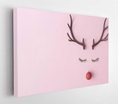 Canvas schilderij - Christmas reindeer concept evergreen fir, red bibon decoration and horns on pastel pink background. The idea of ​​a minimal winter holiday. Flat lay composition