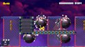 Super Mario Maker 2: Cat Mario loopt op een platform met Bob-ombs, munten en een roze luchtscherm.