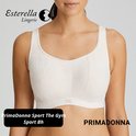 Close-up van een lichtroze sportbeha met stippen en verticale lijnen. Tekst: 'PrimaDonna Sport The Gym Sport Bh'.