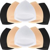 Twee rijen met stapels zwarte, beige en witte driehoekige bh-pads.
