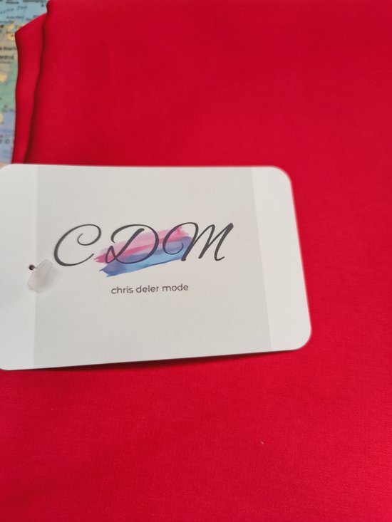 Label van Chris Deler Mode met logo en 'chris deler mode' op een rode sjaal.