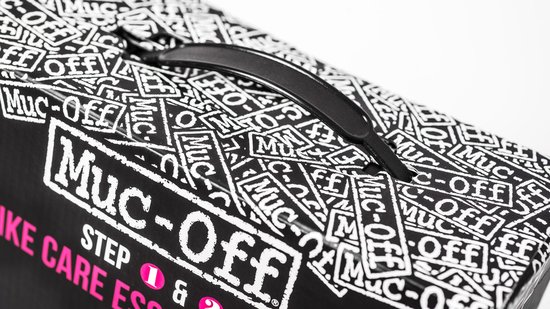 Zwarte doos met een herhalend wit Muc-Off logo patroon en een zwarte handgreep.
