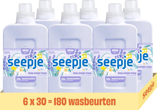 Doos met zes Seepje wasverzachter flessen, met 'Knisperfris' opdruk en lavendel/lelietjes-van-dalen illustratie. 6x30 = 180 wasbeurten.