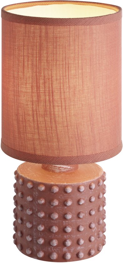 Lampe de table orange avec abat-jour en tissu et base décorée de crampons.