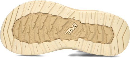 Onderkant van beige Teva sandalen met profiel en 'Teva Spider Rubber' logo.